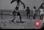 Image of Relna Brewster wrestles male opponent Venice Beach Los Angeles California USA, 1938, second 15 stock footage video 65675028765