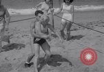 Image of Relna Brewster wrestles male opponent Venice Beach Los Angeles California USA, 1938, second 20 stock footage video 65675028765
