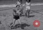 Image of Relna Brewster wrestles male opponent Venice Beach Los Angeles California USA, 1938, second 21 stock footage video 65675028765
