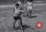 Image of Relna Brewster wrestles male opponent Venice Beach Los Angeles California USA, 1938, second 22 stock footage video 65675028765