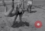 Image of Relna Brewster wrestles male opponent Venice Beach Los Angeles California USA, 1938, second 23 stock footage video 65675028765