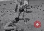 Image of Relna Brewster wrestles male opponent Venice Beach Los Angeles California USA, 1938, second 25 stock footage video 65675028765