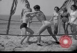 Image of Relna Brewster wrestles male opponent Venice Beach Los Angeles California USA, 1938, second 27 stock footage video 65675028765