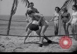 Image of Relna Brewster wrestles male opponent Venice Beach Los Angeles California USA, 1938, second 28 stock footage video 65675028765