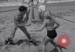 Image of Relna Brewster wrestles male opponent Venice Beach Los Angeles California USA, 1938, second 30 stock footage video 65675028765