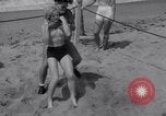 Image of Relna Brewster wrestles male opponent Venice Beach Los Angeles California USA, 1938, second 32 stock footage video 65675028765