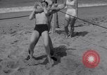 Image of Relna Brewster wrestles male opponent Venice Beach Los Angeles California USA, 1938, second 34 stock footage video 65675028765