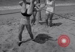Image of Relna Brewster wrestles male opponent Venice Beach Los Angeles California USA, 1938, second 35 stock footage video 65675028765