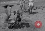 Image of Relna Brewster wrestles male opponent Venice Beach Los Angeles California USA, 1938, second 36 stock footage video 65675028765