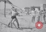 Image of Relna Brewster wrestles male opponent Venice Beach Los Angeles California USA, 1938, second 41 stock footage video 65675028765