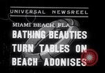 Image of Beach patrol officials and swimsuit models Miami Beach Florida USA, 1938, second 1 stock footage video 65675028768