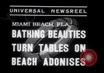 Image of Beach patrol officials and swimsuit models Miami Beach Florida USA, 1938, second 4 stock footage video 65675028768