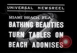 Image of Beach patrol officials and swimsuit models Miami Beach Florida USA, 1938, second 8 stock footage video 65675028768