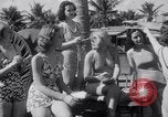 Image of Beach patrol officials and swimsuit models Miami Beach Florida USA, 1938, second 17 stock footage video 65675028768
