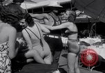 Image of Beach patrol officials and swimsuit models Miami Beach Florida USA, 1938, second 22 stock footage video 65675028768