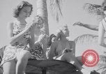 Image of Beach patrol officials and swimsuit models Miami Beach Florida USA, 1938, second 29 stock footage video 65675028768