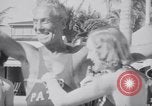 Image of Beach patrol officials and swimsuit models Miami Beach Florida USA, 1938, second 32 stock footage video 65675028768