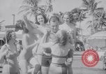 Image of Beach patrol officials and swimsuit models Miami Beach Florida USA, 1938, second 42 stock footage video 65675028768