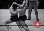 Image of Kimon Kudo beats Jesse James in wrestling New York United States USA, 1938, second 10 stock footage video 65675028783