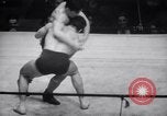 Image of Kimon Kudo beats Jesse James in wrestling New York United States USA, 1938, second 13 stock footage video 65675028783
