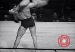 Image of Kimon Kudo beats Jesse James in wrestling New York United States USA, 1938, second 14 stock footage video 65675028783
