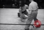 Image of Kimon Kudo beats Jesse James in wrestling New York United States USA, 1938, second 16 stock footage video 65675028783