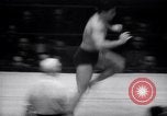 Image of Kimon Kudo beats Jesse James in wrestling New York United States USA, 1938, second 21 stock footage video 65675028783