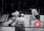 Image of Kimon Kudo beats Jesse James in wrestling New York United States USA, 1938, second 22 stock footage video 65675028783