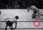 Image of Kimon Kudo beats Jesse James in wrestling New York United States USA, 1938, second 24 stock footage video 65675028783