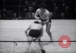 Image of Kimon Kudo beats Jesse James in wrestling New York United States USA, 1938, second 25 stock footage video 65675028783