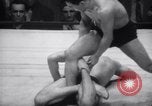 Image of Kimon Kudo beats Jesse James in wrestling New York United States USA, 1938, second 40 stock footage video 65675028783