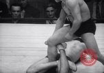 Image of Kimon Kudo beats Jesse James in wrestling New York United States USA, 1938, second 42 stock footage video 65675028783