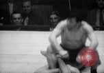 Image of Kimon Kudo beats Jesse James in wrestling New York United States USA, 1938, second 45 stock footage video 65675028783
