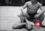 Image of Kimon Kudo beats Jesse James in wrestling New York United States USA, 1938, second 46 stock footage video 65675028783