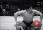 Image of Kimon Kudo beats Jesse James in wrestling New York United States USA, 1938, second 49 stock footage video 65675028783