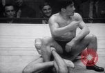 Image of Kimon Kudo beats Jesse James in wrestling New York United States USA, 1938, second 51 stock footage video 65675028783