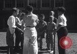 Image of boys refuse to play with a Jewish boy New Haven Connecticut USA, 1940, second 48 stock footage video 65675028784