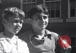 Image of boys refuse to play with a Jewish boy New Haven Connecticut USA, 1940, second 51 stock footage video 65675028784