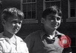 Image of boys refuse to play with a Jewish boy New Haven Connecticut USA, 1940, second 52 stock footage video 65675028784