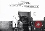 Image of Government's Oil Posters pasted on other companies oil posters Mexico, 1938, second 1 stock footage video 65675028791