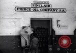 Image of Government's Oil Posters pasted on other companies oil posters Mexico, 1938, second 4 stock footage video 65675028791