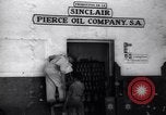 Image of Government's Oil Posters pasted on other companies oil posters Mexico, 1938, second 5 stock footage video 65675028791