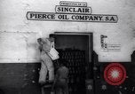 Image of Government's Oil Posters pasted on other companies oil posters Mexico, 1938, second 7 stock footage video 65675028791
