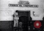 Image of Government's Oil Posters pasted on other companies oil posters Mexico, 1938, second 8 stock footage video 65675028791