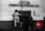 Image of Government's Oil Posters pasted on other companies oil posters Mexico, 1938, second 9 stock footage video 65675028791