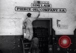Image of Government's Oil Posters pasted on other companies oil posters Mexico, 1938, second 10 stock footage video 65675028791