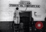 Image of Government's Oil Posters pasted on other companies oil posters Mexico, 1938, second 11 stock footage video 65675028791