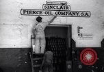 Image of Government's Oil Posters pasted on other companies oil posters Mexico, 1938, second 12 stock footage video 65675028791
