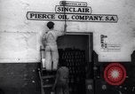 Image of Government's Oil Posters pasted on other companies oil posters Mexico, 1938, second 13 stock footage video 65675028791
