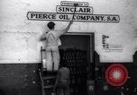 Image of Government's Oil Posters pasted on other companies oil posters Mexico, 1938, second 15 stock footage video 65675028791
